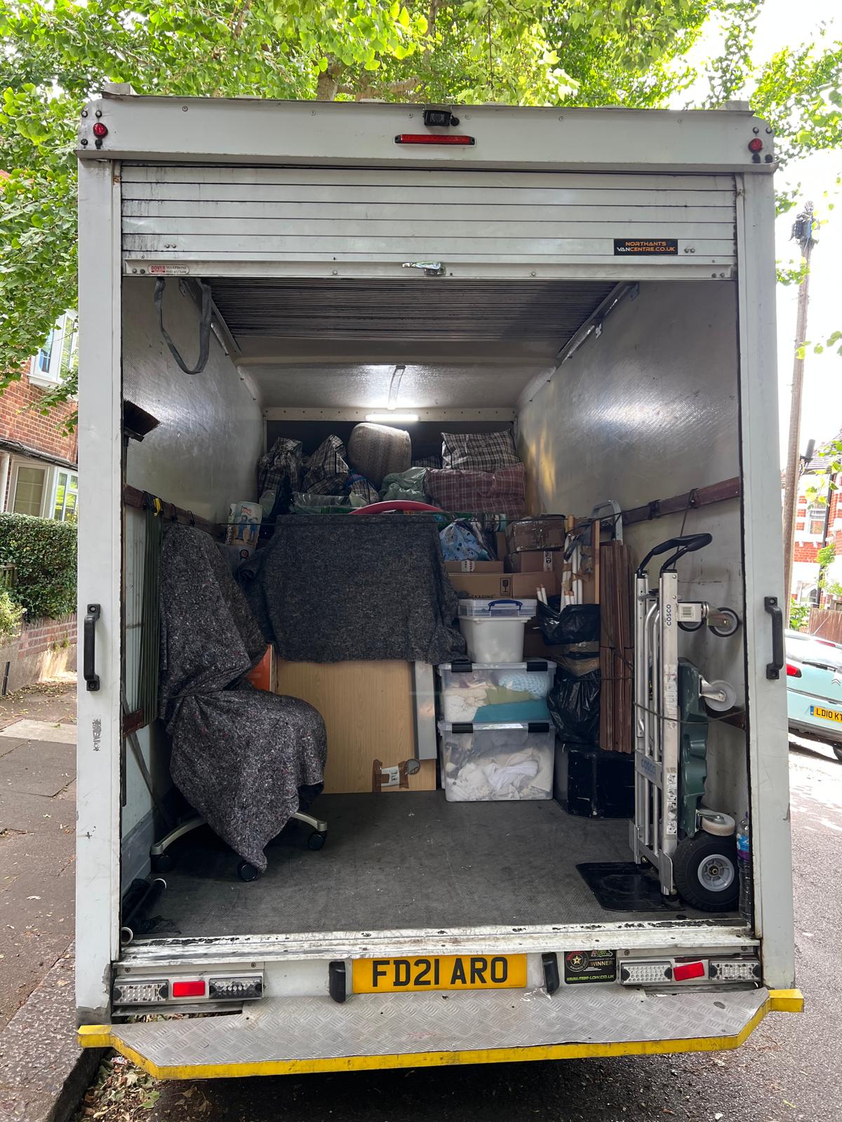 Rear view of a fully loaded luton van ready for a domestic move