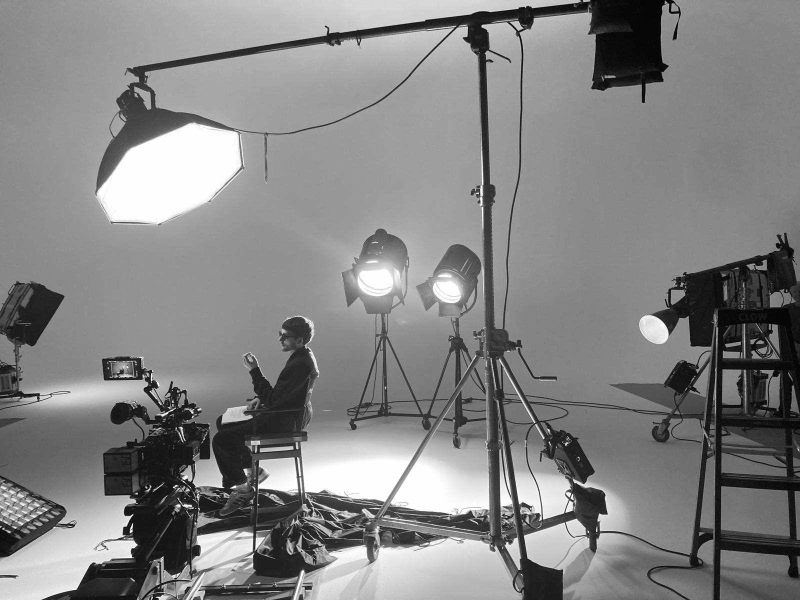Professional film studio with lighting rigs and camera equipment