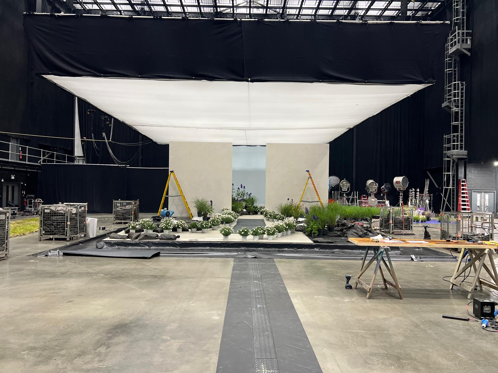 Sound stage set build with lighting rig and floral dressing